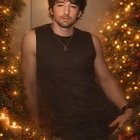 A holiday portrait beside a lit garland