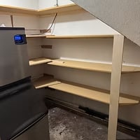 New concession shelving under the stairs