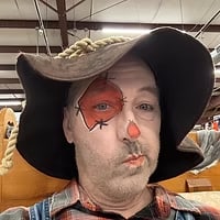 Scarecrow face paint in a straw hat
